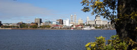 City of Peoria Illinois downtown skyline and trees on the The Illinois River